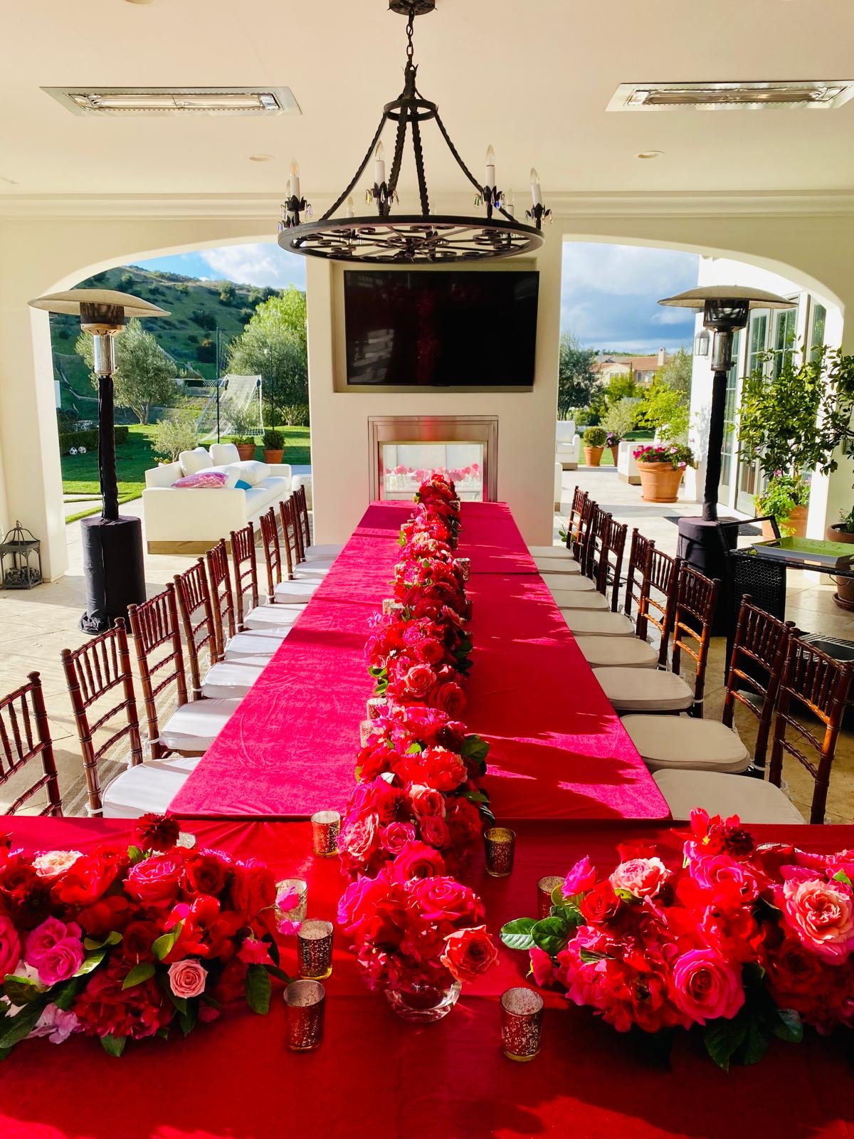 Dramatic gala banquet table styled with abundant florals