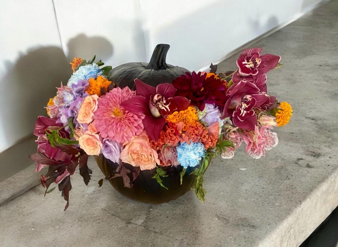 Bold modern sculptural floral arrangement at a product launch