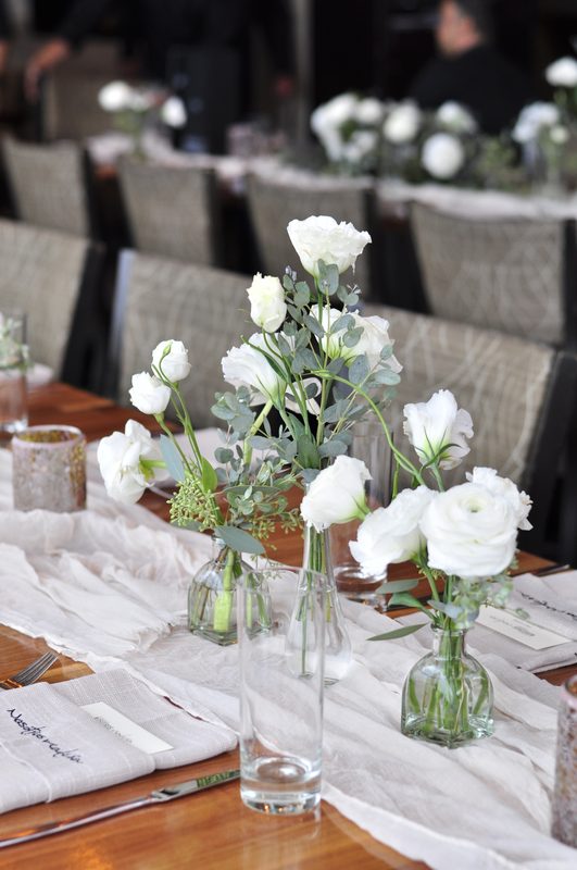Bud vases down the runner