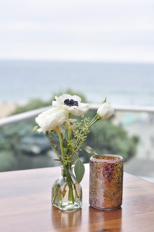 Bud vase with the ocean behind