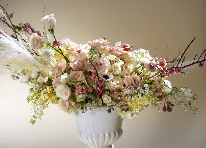 Urn with cherry branches